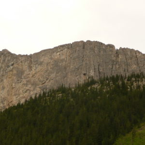 Mount Lawrie, or Yamnuska or "Yam" (slang) comes from a Stoney-Nakota First Nations word that means the "Flat-faced Mountain".